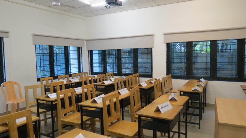 A committee room set with name placards before the first session.