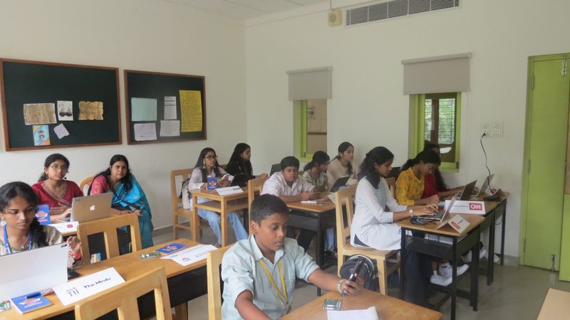 The press corps at work, with desks marked for The Hindu and CNN.